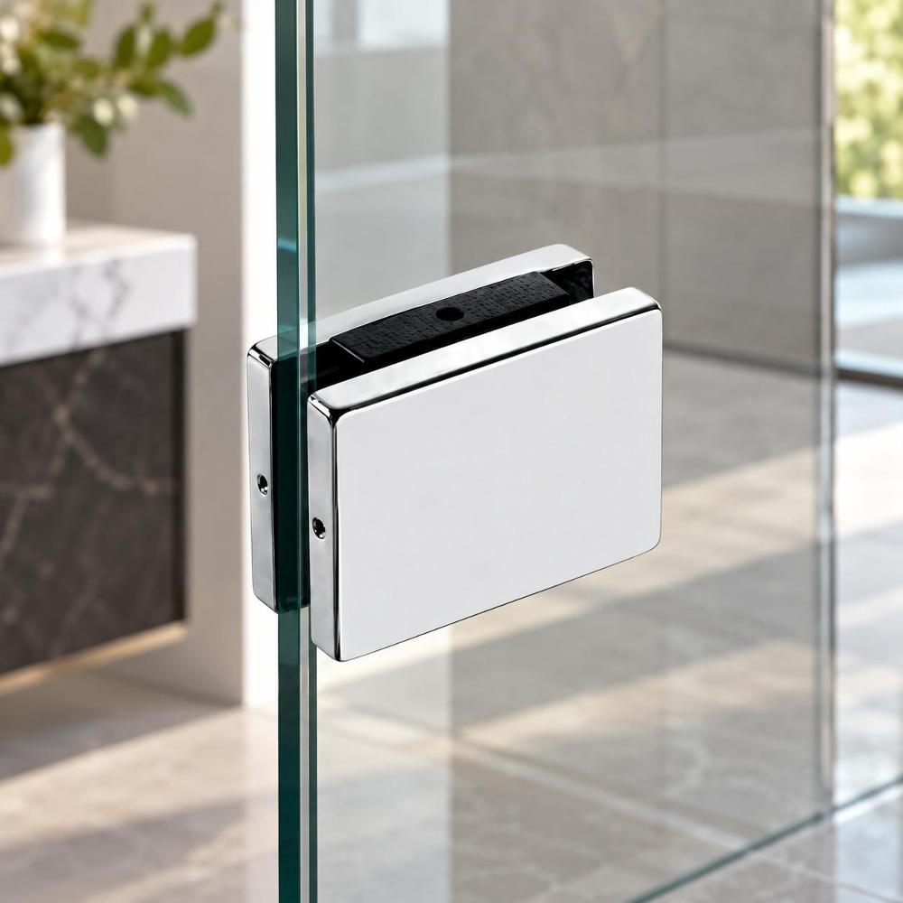 Close-up view of glass door lock hardware showing the internal mechanism and polished stainless steel casing